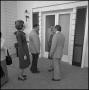 Photograph: [NTSU faculty being greeted at the door for a reception]