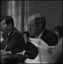 Photograph: [Board of Regents member seated at table during meeting]