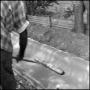 Photograph: [Worker smoothing concrete]