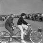 Photograph: [Two young women on a tandem bicycle]