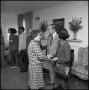 Photograph: [Gov. Dolph Briscoe shaking hands of NTSU faculty]
