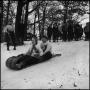 Photograph: [Family riding down the hill on a sled]