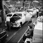 Photograph: [Automobiles in a factory, 14]