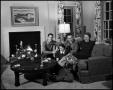Photograph: [Family sitting in their living room, 4]