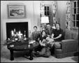Photograph: [Family sitting in their living room, 2]