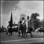 Photograph: [Three women crossing the street]