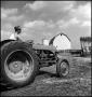 Photograph: [Man driving a small tractor]