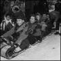 Photograph: [Five people sitting on a toboggan]