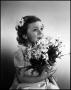 Photograph: [A little holding a bouquet of daisies, 5]