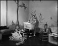 Photograph: [Four children playing in a nursery, 2]