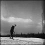 Photograph: [Woman going to ski down a hill]