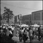 Photograph: [Large group of students walking through UNT campus in between classe…