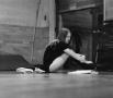 Photograph: [Ballet dancer sitting on the ground]