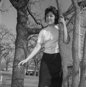 Primary view of object titled '[Josie Cantu posing next to a tree]'.