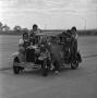 Primary view of [Group shot of NTSU cheerleaders on a car, 6]