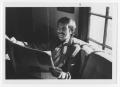 Thumbnail image of item number 1 in: '[Bill Nelson smiling over a paper]'.
