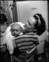 Photograph: [Bernice holding baby Junebug]
