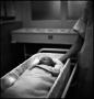 Photograph: [Junebug Clark in a medical bassinet]