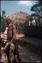 Thumbnail image of item number 1 in: 'Zulu man and beehive huts'.