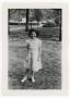 Photograph: [Young woman standing at park]