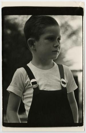 Primary view of object titled '[Print photograph of Tim Williams in overalls]'.