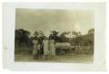 Photograph: [Four women and child in a field]