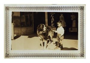 Primary view of object titled '[Frank Cuellar Jr. and a dog]'.