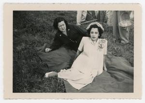 Primary view of object titled '[Chabela and Yolanda Cuellar laying on grass]'.