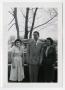 Photograph: [Frank Cuellar Jr. and two women in front of car]