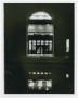 Photograph: [A. M. Willis Library entrance at night]
