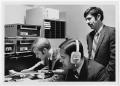 Photograph: [KNTU radio station with two disc jockeys and Dr. Colson]