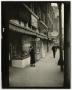Primary view of [Photograph of woman at storefront]