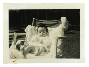 Primary view of object titled '[Johnny Cuellar sitting with ball]'.