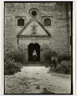 Primary view of object titled '[Photograph of a man in the doorway of Mission Concepción in San Antonio]'.