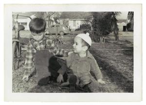 Primary view of object titled '[Johnny Cuellar next to a boy]'.
