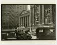 Photograph: [Photograph of large buildings on a city street]