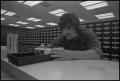 Photograph: [Student using the card catalog]