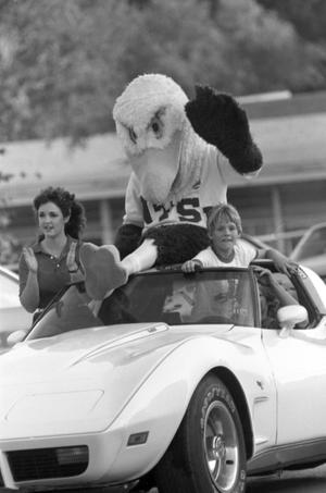Primary view of object titled '["Eppy" riding in the Homecoming Parade, 2]'.