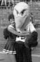 Photograph: [Eppy hugging a cheerleader at a football game]