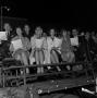 Photograph: [Audience singing during Christmas celebration]