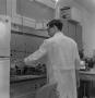 Photograph: [Student in a Chemistry lab, 2]