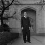 Primary view of [Dr. Ernest Clifton standing in front of the Auditorium English Building]