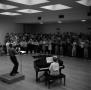 Photograph: [A Cappella Choir rehearsing with Director Frank McKinnely]