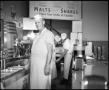 Photograph: [Big Ernie and his cooks at the diner]