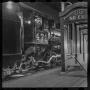 Photograph: [T&P conductor at the station at night]