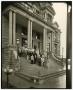 Photograph: [Photograph of men and woman posing in front of courthouse]