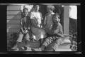 Photograph: [Irene Biffle Williams sitting on a porch with her sons]