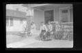 Thumbnail image of item number 1 in: '[Irene Williams sitting on a front porch with her children]'.