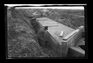 Primary view of object titled '[Men working in ditch]'.
