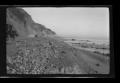 Primary view of [Model T automobiles driving along a shoreline]